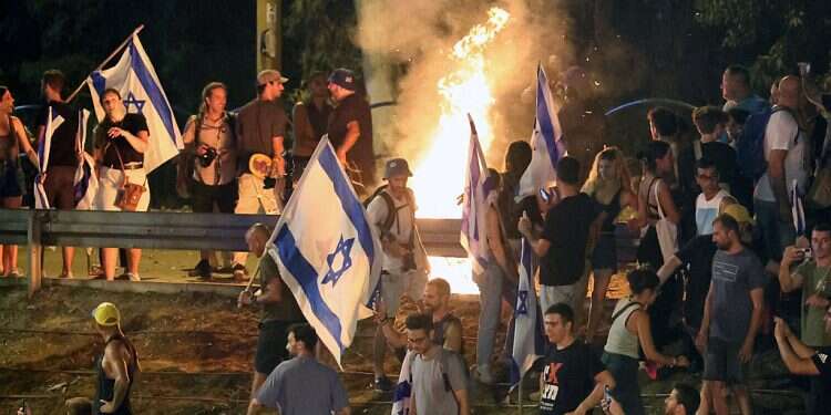 Police clash with protesters for hours after judicial bill passes; Netanyahu vows dialogue on further measures