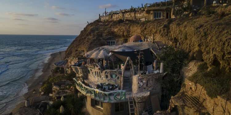 Nissim Kahlon's home, chiseled out of the sandstone cliffs, overlooks the Mediterranean sea in Herzliya, Israel, June 28, 2023 After half century, authorities move to evict squatter from cave home on Herzliya beach