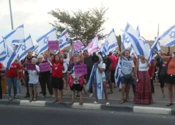 Hundreds protest outside army base where female soldiers were asked to stop singing