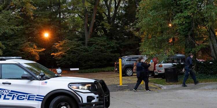Detroit police officers work near the scene where Isaac Agree Downtown Synagogue president, Samantha Woll, was found dead in Detroit, October 21, 2023 Amid Hamas war, Detroit synagogue president murdered