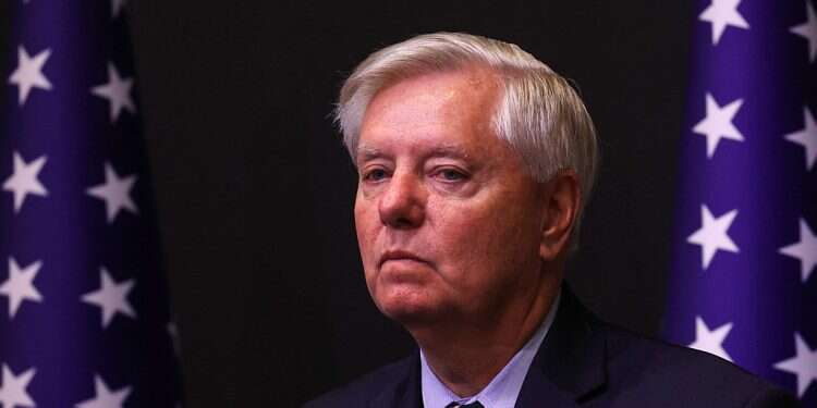 Member of a bipartisan group of US Senators Lindsey Graham looks on as they hold a press conference in Tel Aviv on October 22, 2023. US Senator warns Iran that 'if this war grows, it's coming to your backyard'