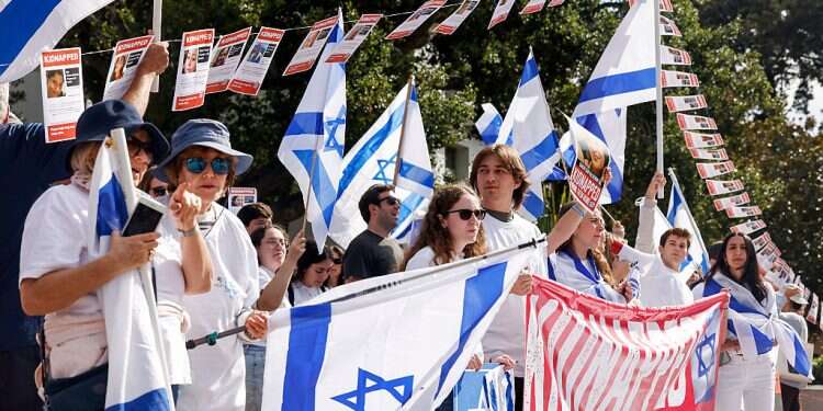 People hold flags and signs as they participate in a rally held in support of Israel at University of California, Berkeley campus in Berkeley, Calif., Friday, Oct. 27, 2023 Jewish leader dismisses far-left criticism of Israel as 'politically insignificant'