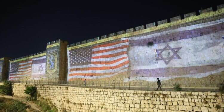 Old City walls illuminated with US flag in honor of Biden