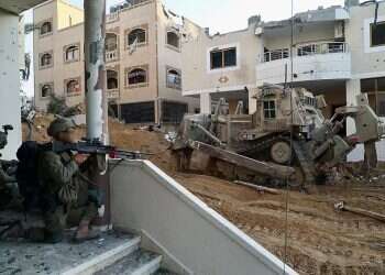 Troops reportedly use bulldozers to expose tunnels in hospital; weapons found