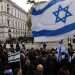 People hold Israeli flags during a vigil for Israeli victims held outside Downing Street in London, Britain, Nov. 7, 2023