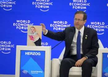 A hostage for a third of his life: Herzog displays Bibas' photo at World Economic Forum to mark sad birthday