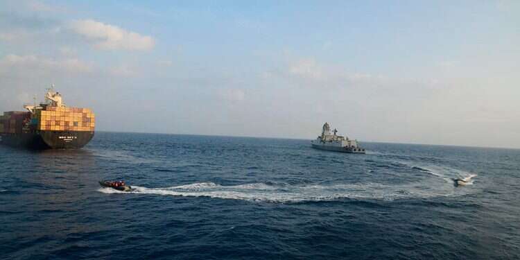 A firefighting team from Indian Navy vessel INS Kolkata responding to a fire on Liberian-flagged Merchant ship MSC Sky II caused due to a suspected drone/missile attack in the Gulf of Aden, Tuesday, March 5, 2024 2 dead in first fatal Houthi attack on Red Sea shipping