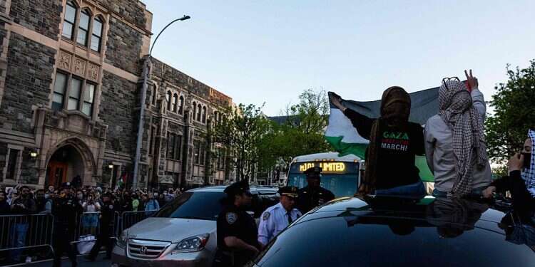 Pro-Palestinian protesters occupy a building where they had established an encampment at Fordham University Lincoln Center campus on May 1, 2024 Columbia moves final exams online as tensions boil over