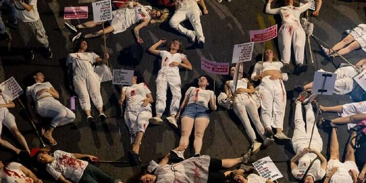 Protesters take part in a presentation during a demonstration calling for a hostage deal on May 18, 2024 in Tel Aviv, Israel Hostage release deal or military operation in Rafah? Israelis sharply divided