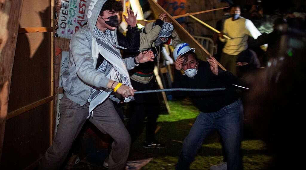 Demonstrators clash at a pro-Palestinian encampment at UCLA on May 1, 2024, in Los Angeles. Photo credit: Ethan Swope/AP Exclusive: Israelis at Columbia, Yale on grim reality of Jewish students in 2024