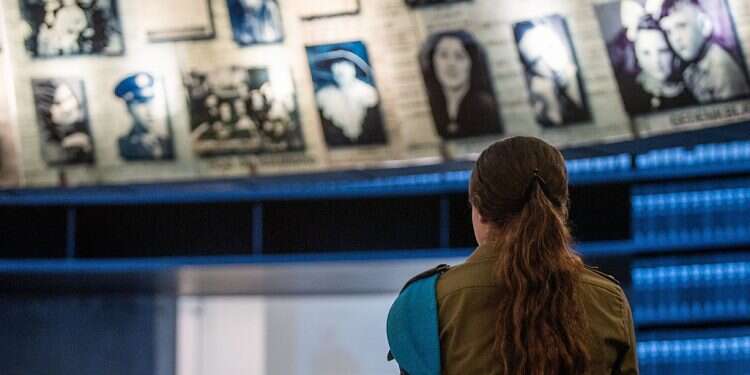 An Israeli soldier at the Yad Vashem Holocaust Memorial in Jerusalem, May 2, 2024 PM vows to fight Hamas, destroy 'Nazi monsters' at Holocaust Remembrance Day ceremony