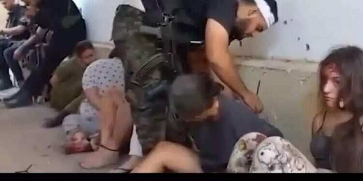 A screenshot taken of the footage showing the kidnapping of IDF female field observers on Oct. 7 by Hamas terrorists 3 minutes of horror – Chilling footage from kidnapping of IDF female troops aired