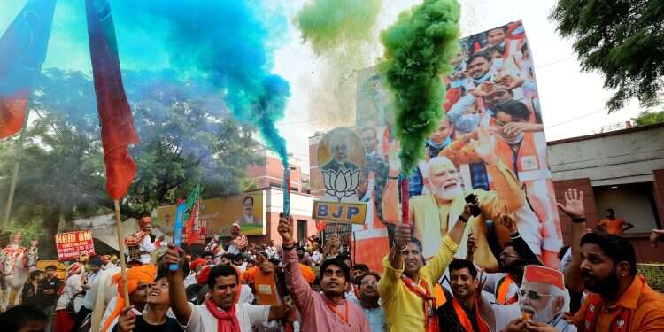 Bharatiya Janata Party (BJP) supporters celebrate after Indian prime minister claimed their party's victory in the election results at the BJP headquarters in New Delhi, India, June 4, 2024 Modi got his 3rd term – with a serving of humble pie