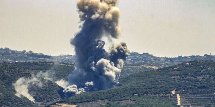 Smoke billows from the site of an Israeli airstrike on Zibqin in southern Lebanon on June 12, 2024 amid ongoing cross-border tensions Hezbollah fires scores of rockets after IDF takes out senior operative