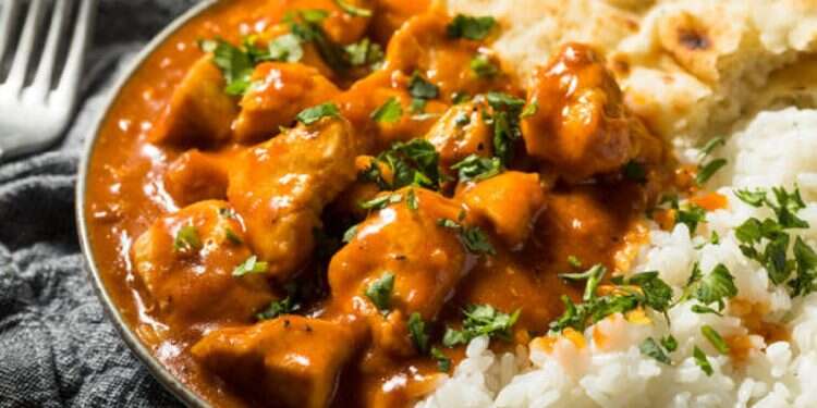 Homemade Indian Butter Chicken with Rice and Naan Bread The plot chickens: Who invented the staple buttery Indian dish?