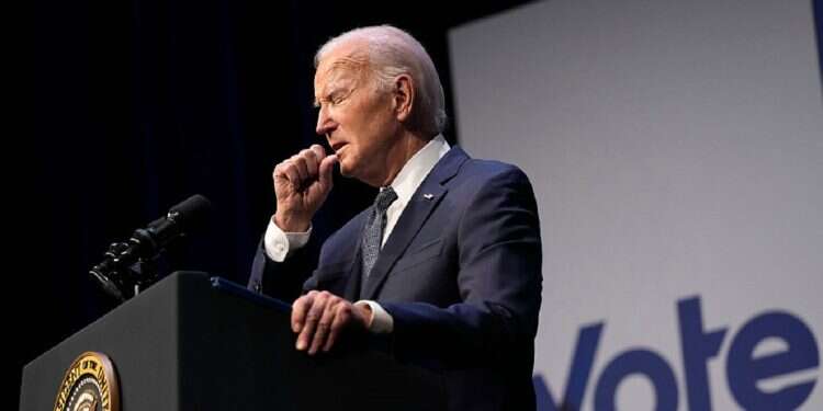 President Joe Biden coughs during an event with Rep. Steven Horsford, D-Nev., in Las Vegas, Tuesday, July 16, 2024 Biden tests positive for COVID, cancels campaign events