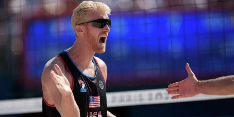 Chase Budinger celebrates a point against France in a beach volleyball match at the 2024 Olympics
