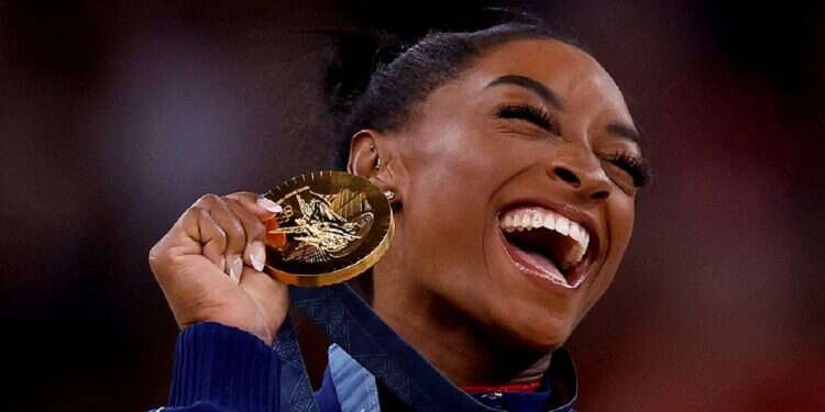 American gold medallist Simone Biles celebrates on the podium with her medal in the Paris Olympics, August 03, 2024
Olympian mindset: What makes a champion?