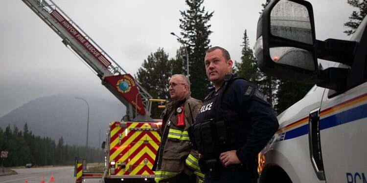 Hinton Fire Chief Mac de Beaudrap and an RCMP officer in Jasper, Alberta on Aug. 16, 2024 Over 100 Canadian Jewish organizations receive bomb threats