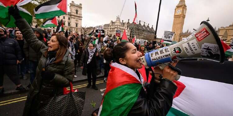 A woman leads a chant by Pro-Palestinian protestors as they gather in Parliament Square to call for an end to arms support to Israel, on April 17, 2024 in London, England 'British elites are in complete denial about attempts to Islamize the West'