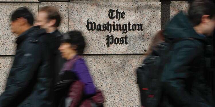 People walk by the One Franklin Square Building, home of The Washington Post newspaper, in downtown Washington, Feb. 21, 2019 The Post reacts to losing quarter-million subscribers over endorsement policy