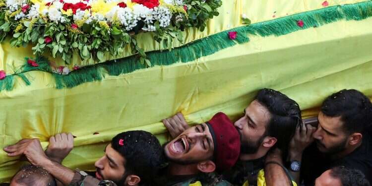 Men carry the coffin of Mohammad Mahdi Ammar, son of Hezbollah member of the Lebanese parliament, Ali Ammar, who was killed amid the detonation of pagers across Lebanon, during his funeral in Beirut, Lebanon Sept. 18, 2024 Revealed: Israel's 9-year operation that fooled Hezbollah