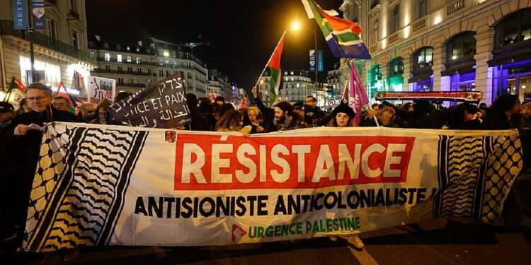 Protesters hold a banner reading 'Anti-Zionist Anti-Colonialist Resistance' during a protest organized by Pro-Palestinian associations and French leftist parties in solidarity with the Palestinian and Lebanese people in Paris, France, November 13, 2024 'The events in Amsterdam could happen in Paris, London or Madrid'