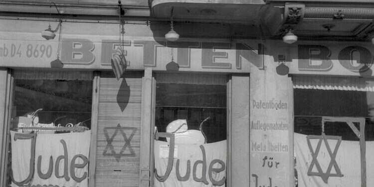 A Jewish-run shop bearing Nazi antisemitic graffitis during the June 1938 antisemitic campaign 86 years after Kristallnacht, Europe is the same
