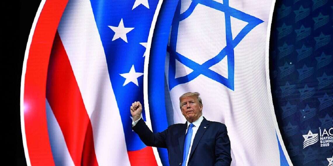 US President Donald Trump stands on stage after his address to the Israeli American Council National Summit 2019 at the Diplomat Beach Resort in Hollywood, Florida on December 7, 2019 Trump's team herald new US-Israel golden age