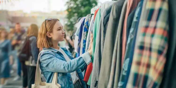 A young woman at a vintage market. Photo: GettyImages The dangerous diseases hiding in vintage clothes