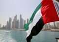The UAE flag flies over a boat at Dubai Marina, Dubai, United Arab Emirate. Photo: Reuters / Ahmed Jadallah Why does everyone want to be Syria's ally?