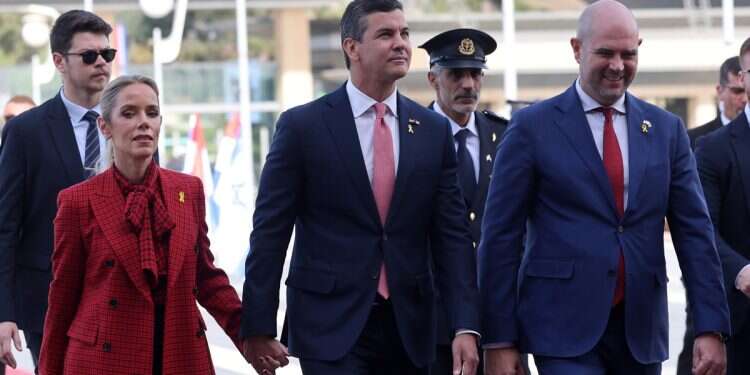 Speaker of the Knesset of Israel, Amir Ohana (R), welcomes the President of Paraguay, Santiago Pena (C), and his wife, Leticia Ocampos (L), during an official welcome ceremony at the Knesset in Jerusalem, December 12, 2024 Paraguay's president arrives to dedicate embassy as PM vows to fight Iran