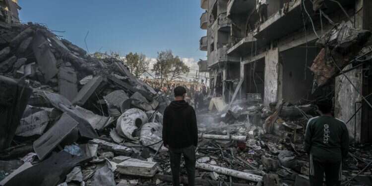 Palestinians search for bodies and survivors among the rubble of destroyed buildings following Israeli airstrikes in Al Nuseirat refugee camp, central Gaza Strip, 13 December, 2024 Report exposes Hamas inflation of death toll