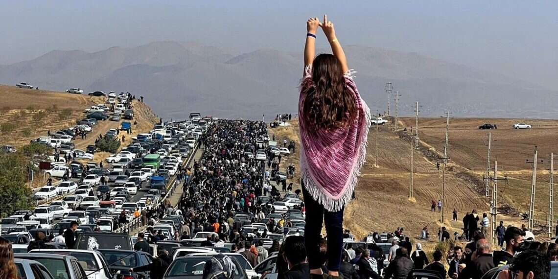Students march to Mahsa Amini's grave in Saqez, Kurdistan province, as an unveiled woman stands atop a vehicle during the 40-day commemoration of Amini's death (UGC/AFP) Why Iranians rising up against the regime is just a matter of time