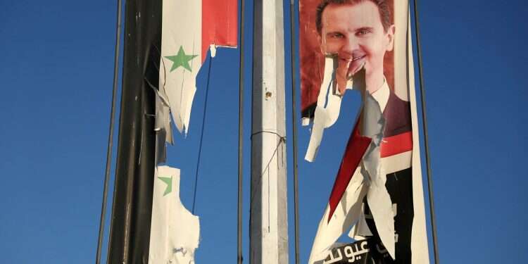 Syrian rebels have managed to surprise the regime and taken over key sites. Pictured: A torn image of President Bashar Assad IDF confirms Iranian-led forces sent to repel Syrian rebels