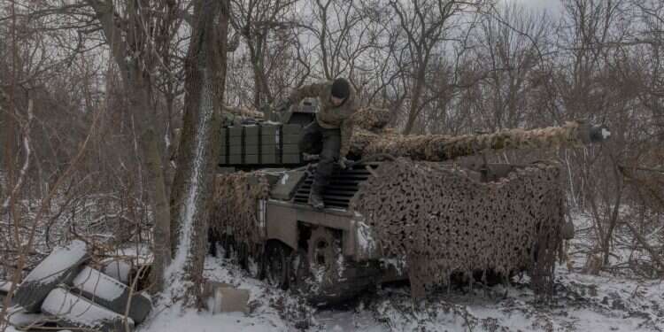 A Ukrainian tank crew member of the 68th Jaeger Brigade stands on a Leopard 1A5 tank on Dec. 13, 2024 30000 graves: Sweden prepares for war with Russia