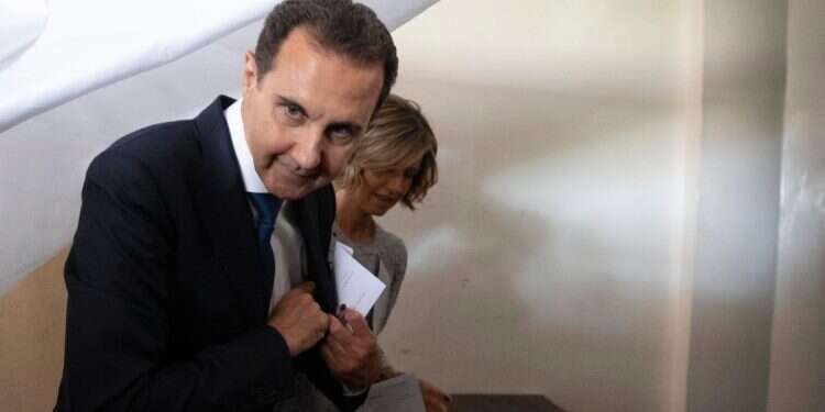 Then-Syrian President Bashar Assad and his wife Asma prepare to vote at a polling station during the presidential elections in the town of Douma, in the eastern Ghouta region, near the Syrian capital Damascus, Syria, May 26, 2021 Bashar Assad going through divorce? Not so fast