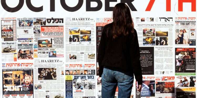 A woman looks on an installation marking the release of hostages kidnapped during the deadly October 7, 2023 attack by Hamas, at the Hostages Square in Tel Aviv, Israel, January 20, 2025 A heart divided