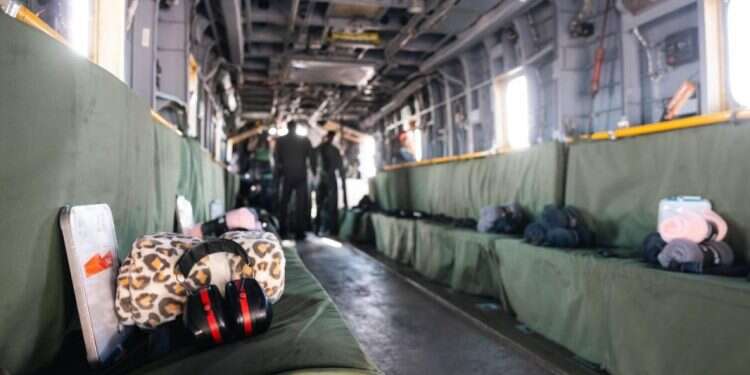 A rescue helicopter stands ready with a leopard-print blanket , a symbol of the campaign to raise awareness for hostage Romi Gonen LIVEBLOG: Romi, Doron, and Emily have returned to Israel