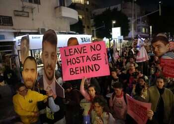 Protesters hold up portraits of Israeli hostages during a march from Dizengoff Square to the US embassy calling to complete the hostage deal between Israel and Hamas, in Tel Aviv, Israel, February 4, 2025. Photo credit: Netanyahu orders to advance hostage talks