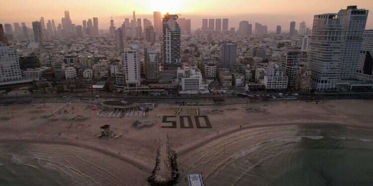 A drone view shows Israeli protesters display the numbers 500 and 73 to mark the 500 days since October 7, 2023 when Hamas attacked Israel and took hostages, at the shore of the Mediterranean opposite the U.S. Consulate in Tel Aviv, Israel, February 17, 2025. The number 73 represents the number of hostages still in captivity in Gaza Navigating Gaza without a vision: This is how we'll reach day 1,000