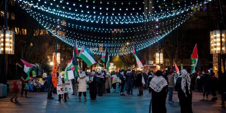 People gather wuth Palestinian flags in Vancouver, British Columbia, Wednesday, Jan. 15, 2025. Photo credit: Ethan Cairns/The Canadian Press via AP Repackaging of Nazi-era tactics in a modern context