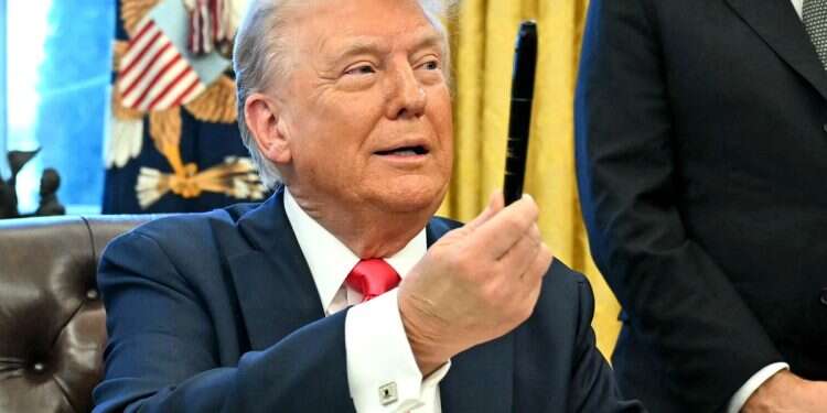 US President Donald Trump holds a sharpie after signing an Executive Order at the Oval Office of the White House in Washington, DC on February 25, 2025 Not all of Trump's envoys truly speak for him