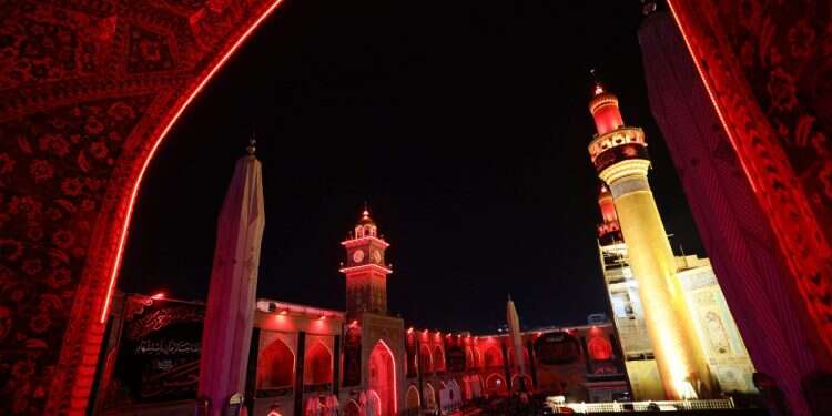 Shiite worshippers gather for a ritual commemorating the 7th century killing of Imam Ali, the cousin, son-in-law, and companion of the Prophet Muhammad, during the Muslim month of Ramadan in Iraq's holy city of Najaf on March 21, 2025 Billion-dollar budget: Iran's plan for control in Iraq