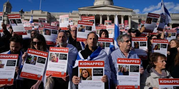 Israeli supporters show placards with the faces and names of people taken hostage and held in Gaza, during a protest in Trafalgar Square, London, Sunday, Oct. 22, 2023 (Photo: AP/Frank Augstein) London university 'Understanding Hamas' book launch met with protest, but not canceled