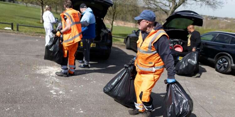 Residents hand rubbish to refuse workers at a Mobile Household Waste Centre in Senneleys Park on April 08, 2025 in Birmingham, England Rats in the council and streets: Sanitation strike leaves Birmingham in the bin