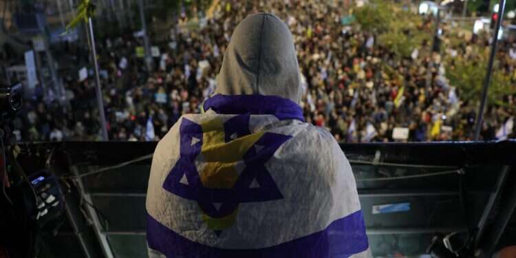 Families of Israeli hostages held by Hamas in Gaza and their supporters take part in a protest calling for the completion of a hostage deal between Israel and Hamas, outside the Kirya military headquarters in Tel Aviv, Israel, April 26, 2025 How do Israelis keep going?