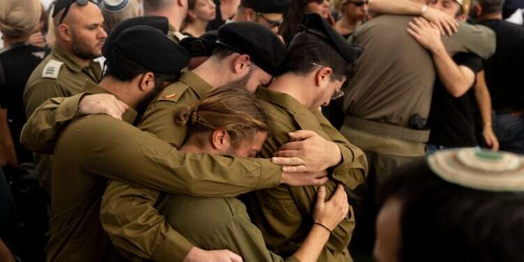 Israeli soldiers mourn during a funeral for Master Sergeant (res) Asaf Cafri killed in a battle in the northern Gaza Strip on April 27, 2025 in Beit Hashmonai, Israel IDF's digital security nightmare: Sensitive information still flows freely on social media