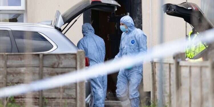 Police forensic officers search a house on May 4, 2025, in Rochdale, England UK arrests 8 in Iranian terror plot crackdown