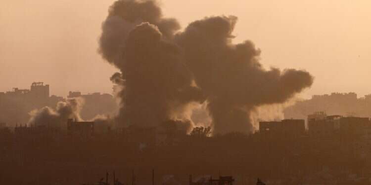 Smoke rises from North Gaza after an explosion, near the Israel-Gaza border as seen from Israel, May 24, 2025 Israelis, a former CIA official and $100M: The real players in the Gaza aid scheme